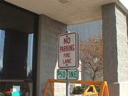 Acceptable Fire Lane Sign in Front of Building Entrance