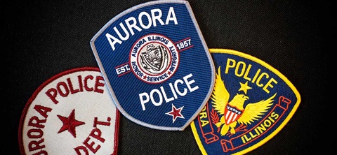 Different variations of the aurora police department badge