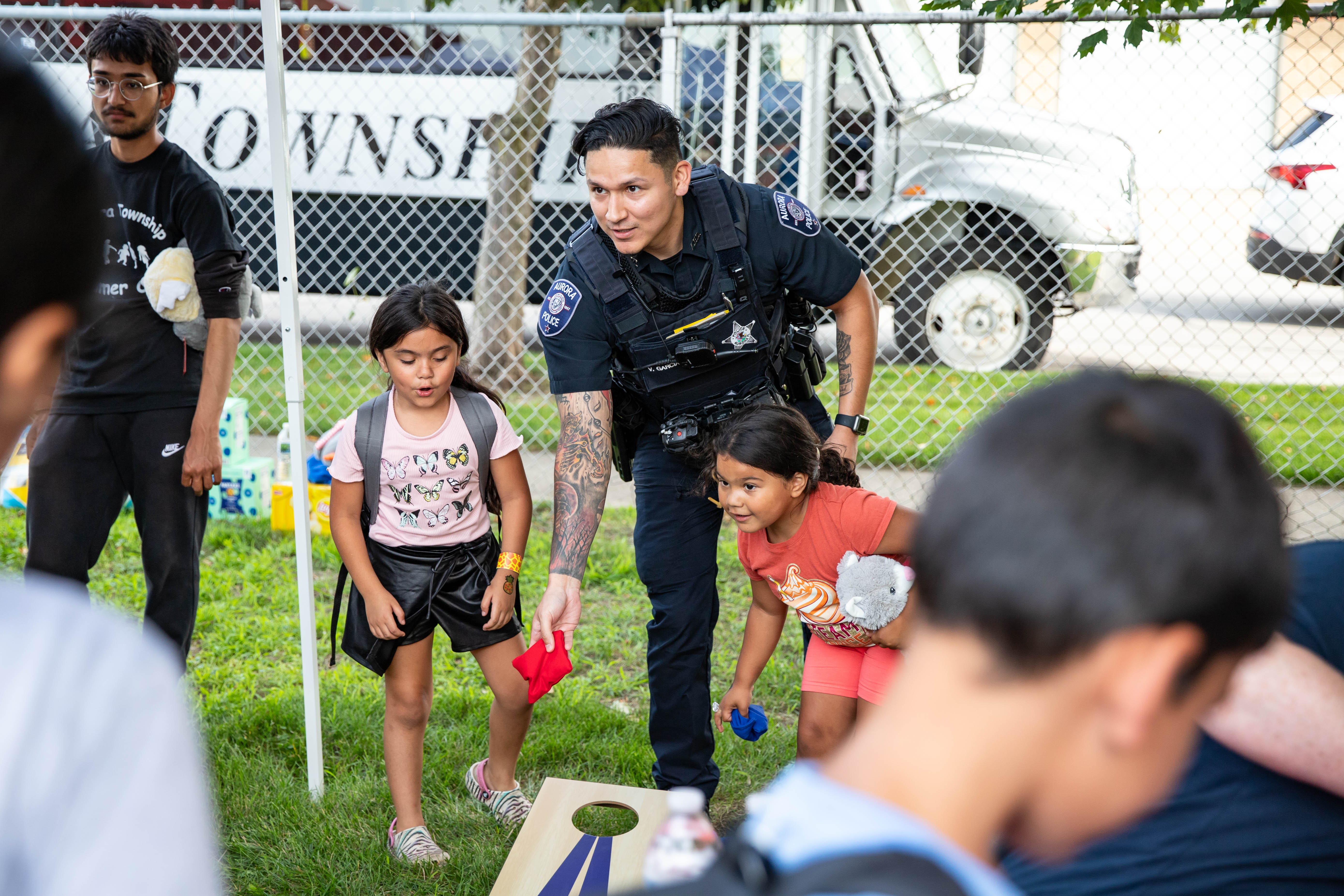 Officer playing with kids